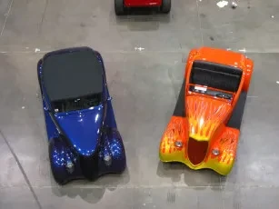 Blue and orange toy cars overhead view