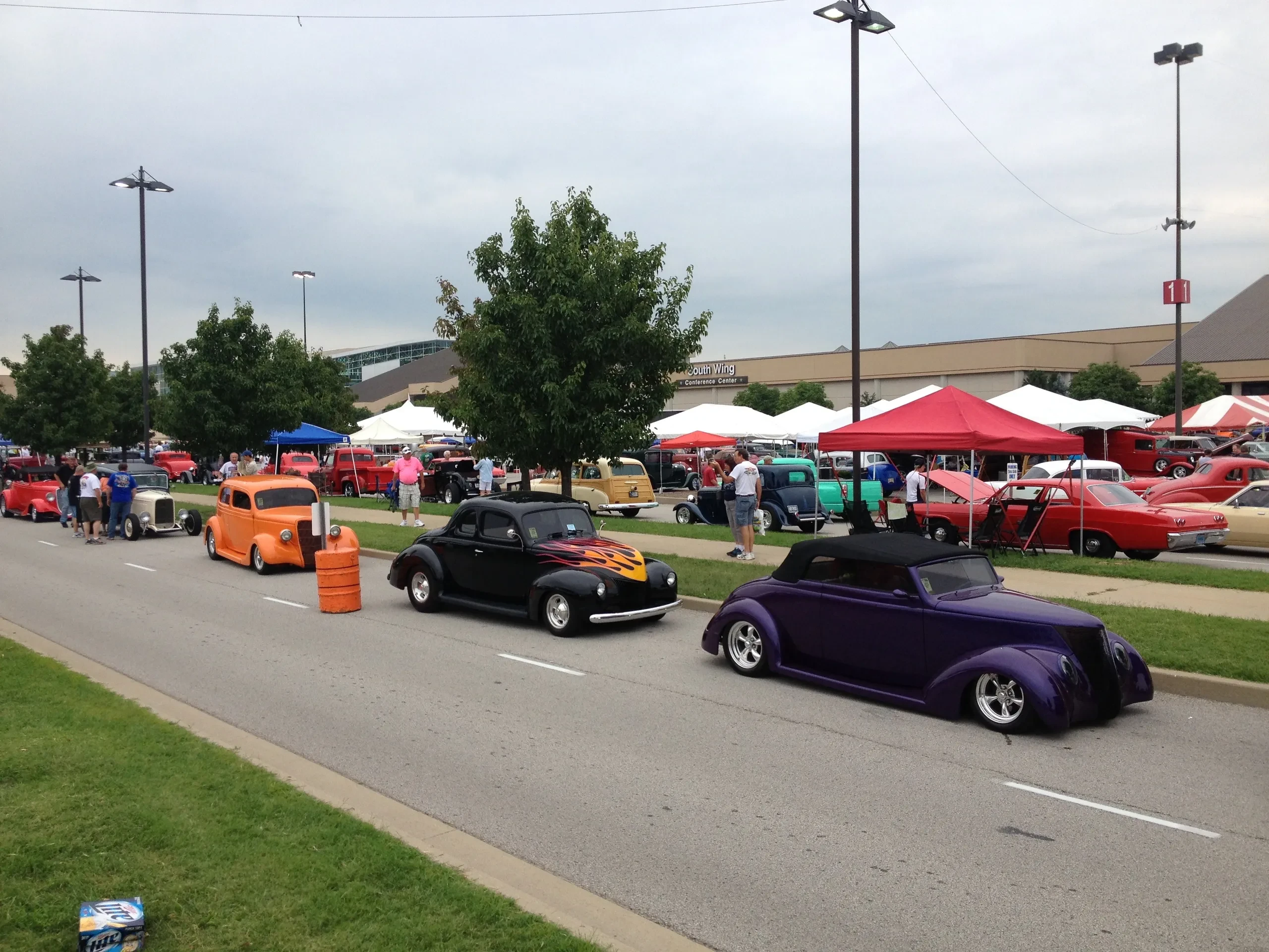 Orange, black and purple hot rods at car show