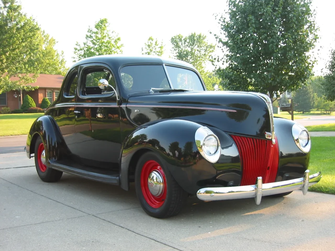 Black and red vintage coupe side view
